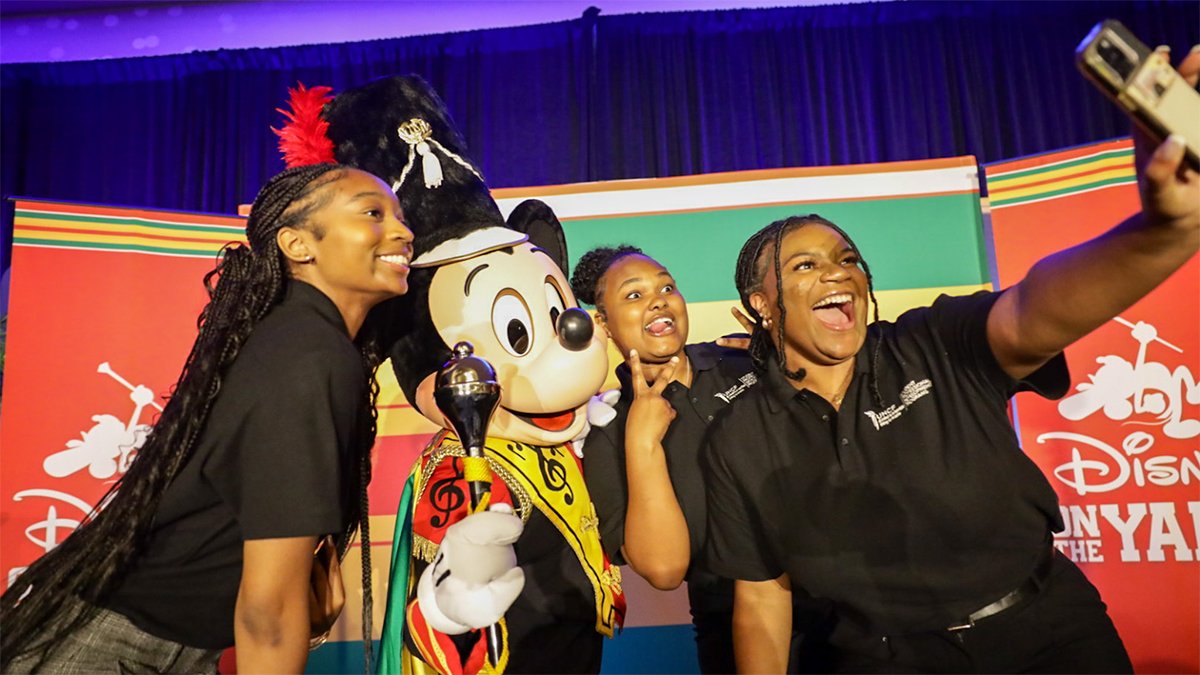 UNCF SLC 2025 Scholars posing with Drum Major Mickey Mouse