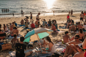 Photo by Clément Proust from Pexels: https://www.pexels.com/photo/crowded-beach-party-at-sunset-38996205/