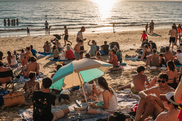 Photo by Clément Proust from Pexels: https://www.pexels.com/photo/crowded-beach-party-at-sunset-38996205/