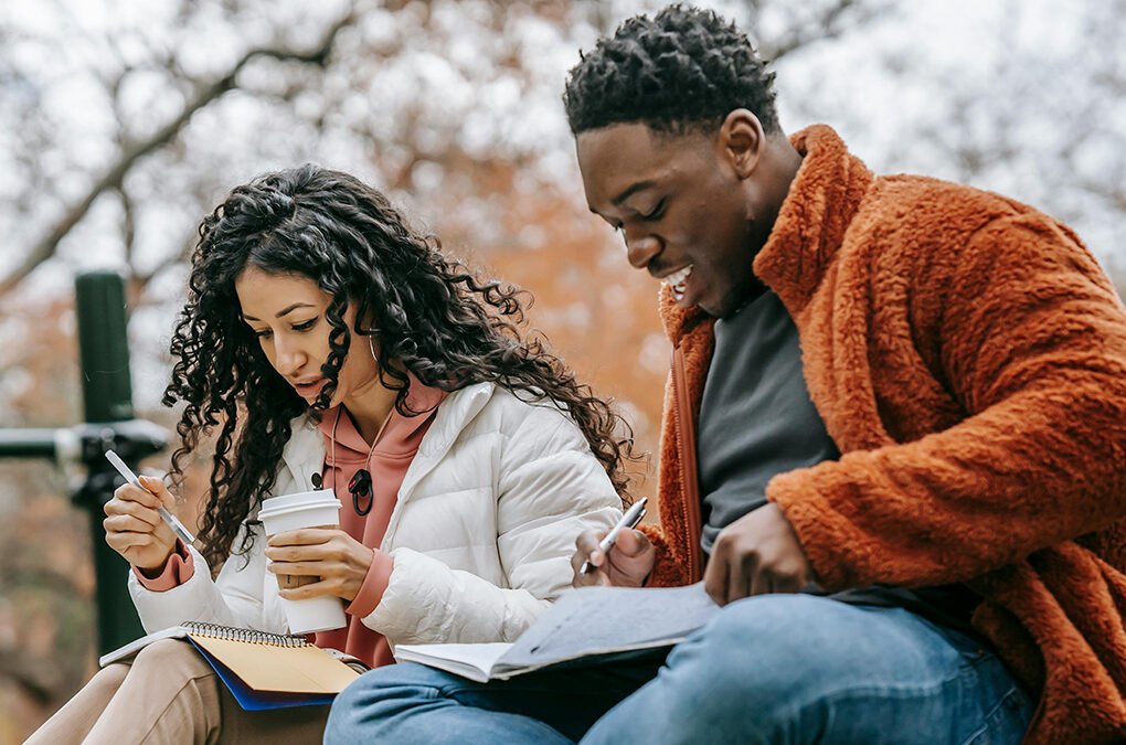 Photo by Keira Burton: https://www.pexels.com/photo/multiethnic-couple-with-copybooks-studying-on-grassy-lawn-6146981/