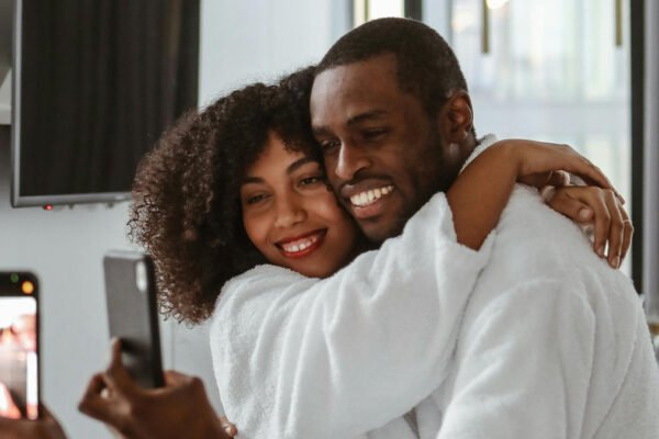 Photo by Polina Tankilevitch: https://www.pexels.com/photo/man-and-woman-in-bathrobes-taking-selfie-6429539/