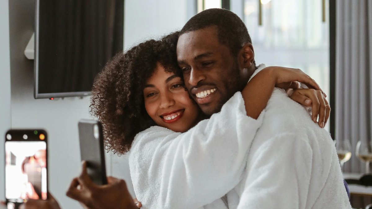 Photo by Polina Tankilevitch: https://www.pexels.com/photo/man-and-woman-in-bathrobes-taking-selfie-6429539/